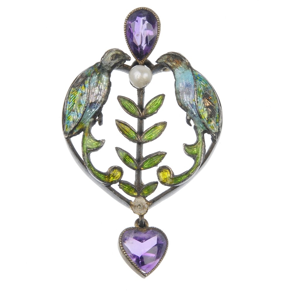An early 20th century enamel, seed pearl and amethyst: An early 20th century enamel, seed pearl and amethyst pendant, designed as a central green enamel leaf and seed pearl line, flanked by two blue and green enamel birds to the pear-shape amethyst suspen
