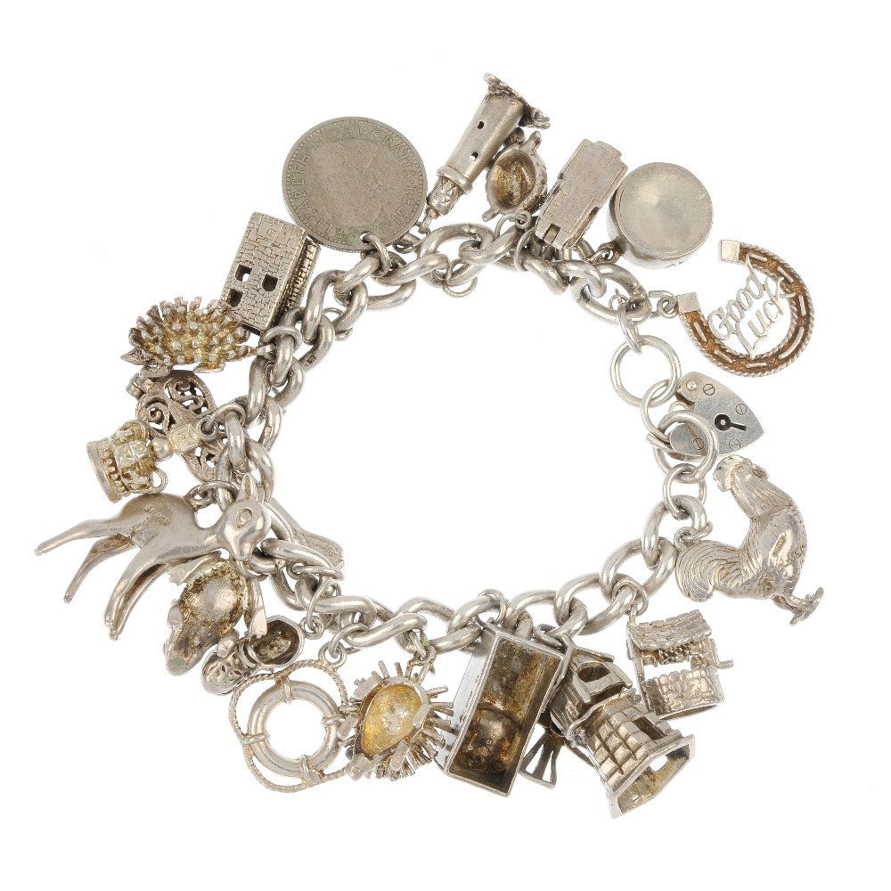 Two charm bracelets and three loose charms.: Two charm bracelets and three loose charms, the curb and double curb-link bracelets suspending a total of twenty-six charms to include a light house and a windmill, both with heart padlock clasps, wit