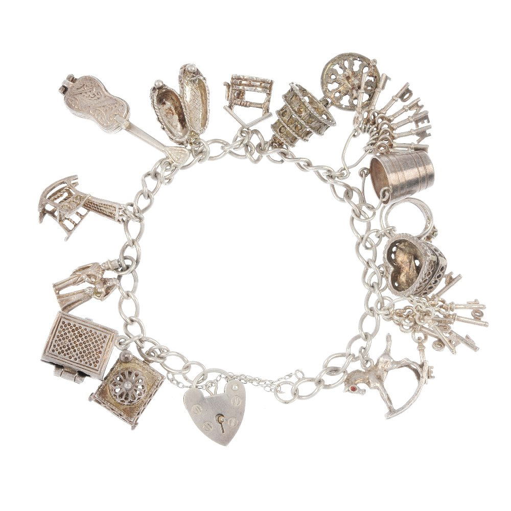 Four charm bracelets.: Four silver and white metal charm bracelets, the curb, double curb and belcher-link bracelets suspending a total of thirty-three charms to include a wedding cake and a birdhouse, two with heart padloc