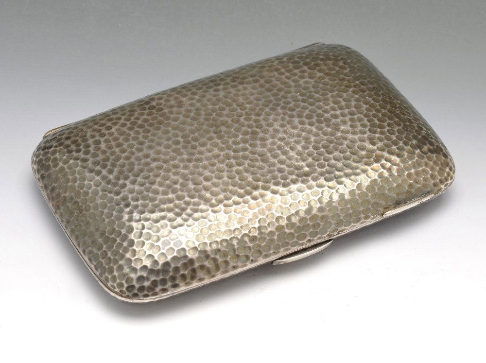 A Victorian silver cigar case.: A Victorian silver cigar case, the oblong form with hammered finish, opening to the silver-gilt interior, personal inscription and hinged clip. Hallmarked George Unite & Sons, London 1869. Height meas