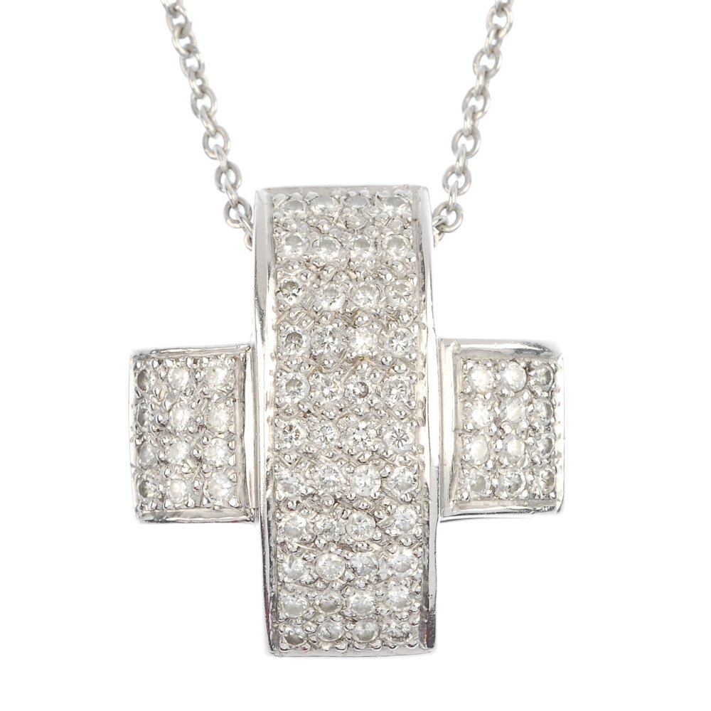 (120338) A selection of jewellery and a wrist watch.: (120338) A selection of jewellery and a wrist watch. To include a pave-set diamond cross pendant suspending on a fine belcher-link chain, a cubic zirconia pendant and a stainless steel Technomarine wr