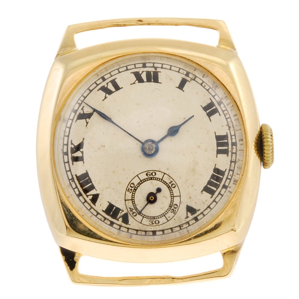 A 9ct gold manual wind gentleman's watch head with a: A 9ct gold manual wind gentleman's watch head, the silvered dial with black Roman numerals, minute track, subsidiary seconds dial positioned to six o'clock, cushion shaped case, unsigned movement. Cas