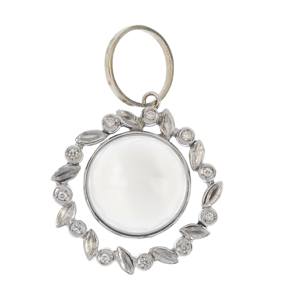 A moonstone and diamond pendant.: A moonstone and diamond pendant. The circular moonstone cabochon, within a brilliant-cut diamond foliate surround. Estimated total diamond weight 0.10ct. Length 3.5cms. Weight 7gms.