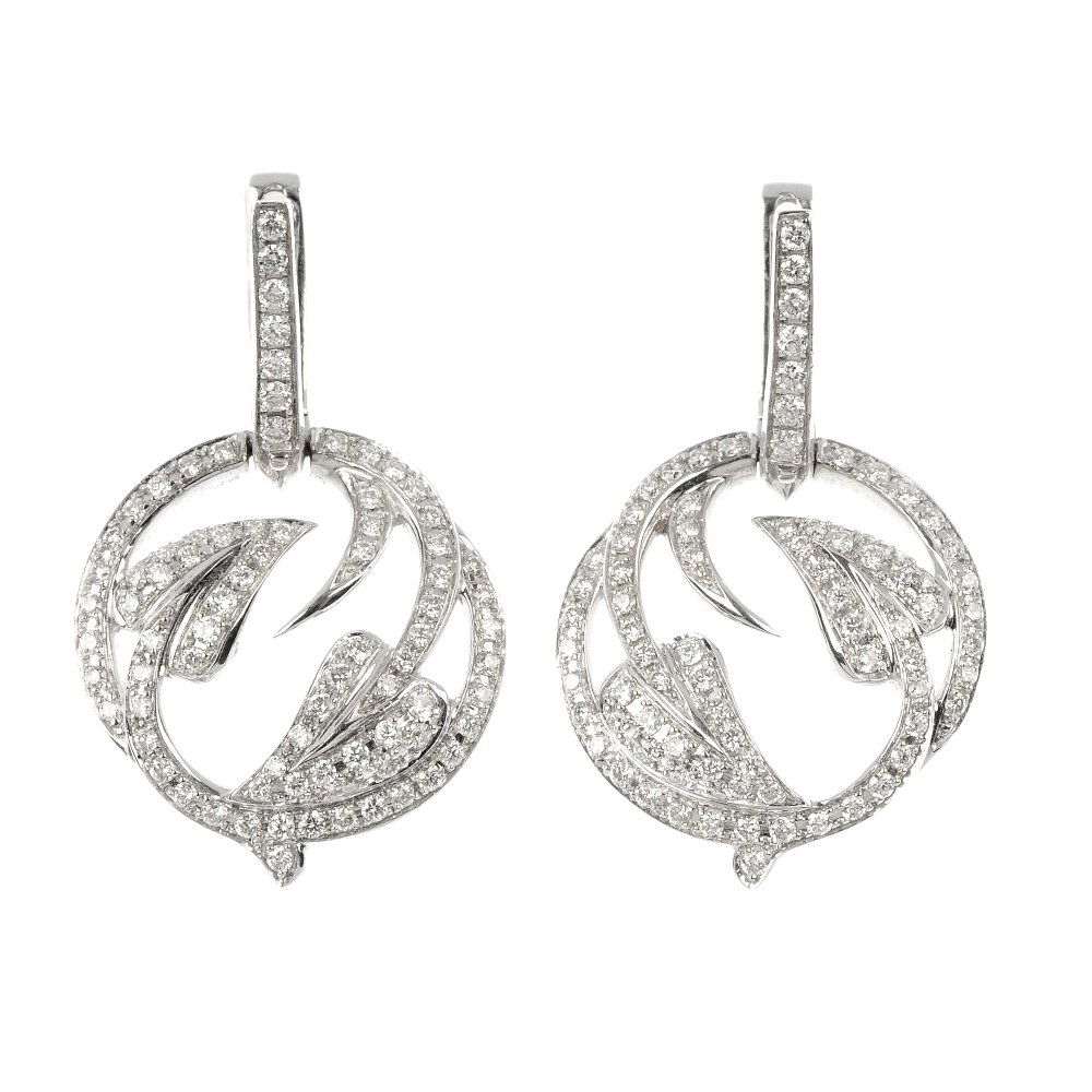 STEPHEN WEBSTER - a pair of 18ct gold diamond 'Poison: STEPHEN WEBSTER - a pair of 18ct gold diamond 'Poison Ivy' ear pendants. Of openwork design, each composed of a pave-set diamond curved foliate motif, suspended from a pave-set diamond removable surmo