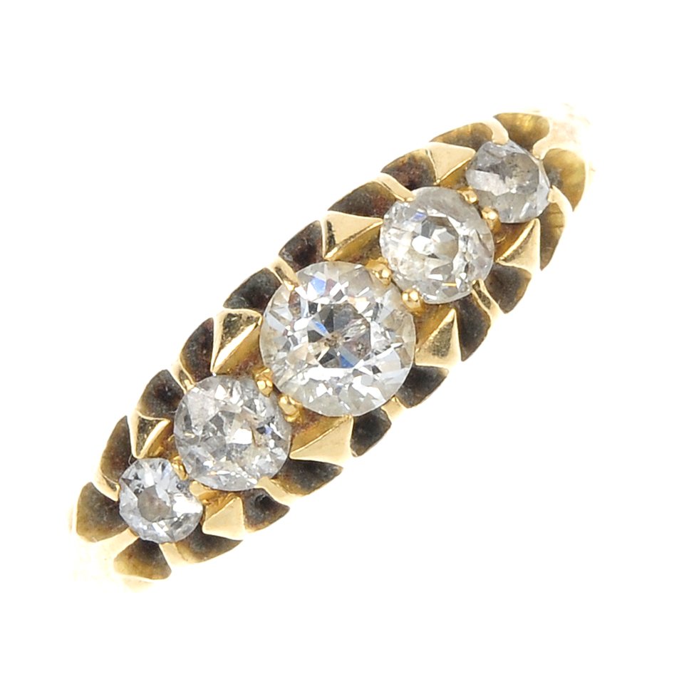 An Edwardian 18ct gold diamond five-stone ring.: An Edwardian 18ct gold diamond five-stone ring. The graduated old-cut diamonds, to the plain band. Estimated total diamond weight 0.45ct. Hallmarks for Birmingham, 1904. Weight 2.3gms.