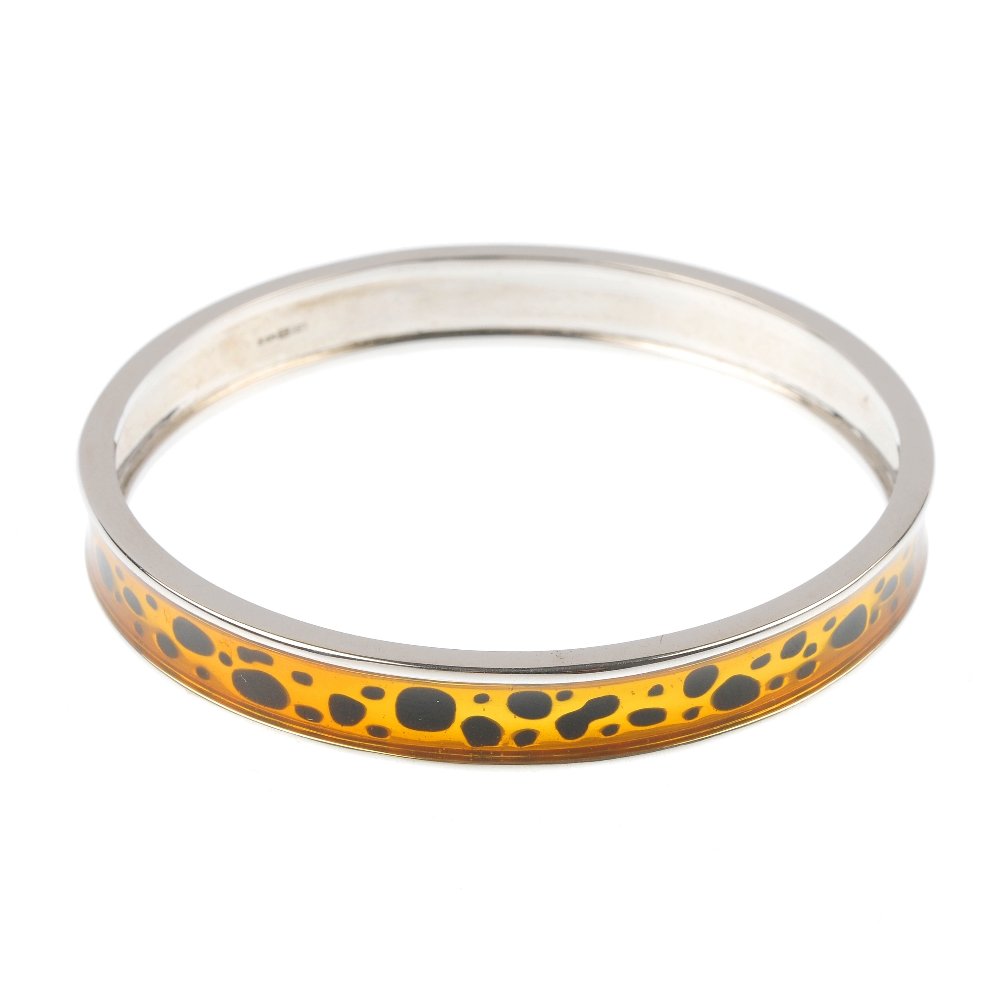 BIBA - a selection of silver jewellery.: BIBA - a selection of silver jewellery, to include two enamel animal print bangles, together with a matching band ring. Stamped Biba. Hallmarks forLondon. Inner diameter of bangles 6.5cms. Ring size L