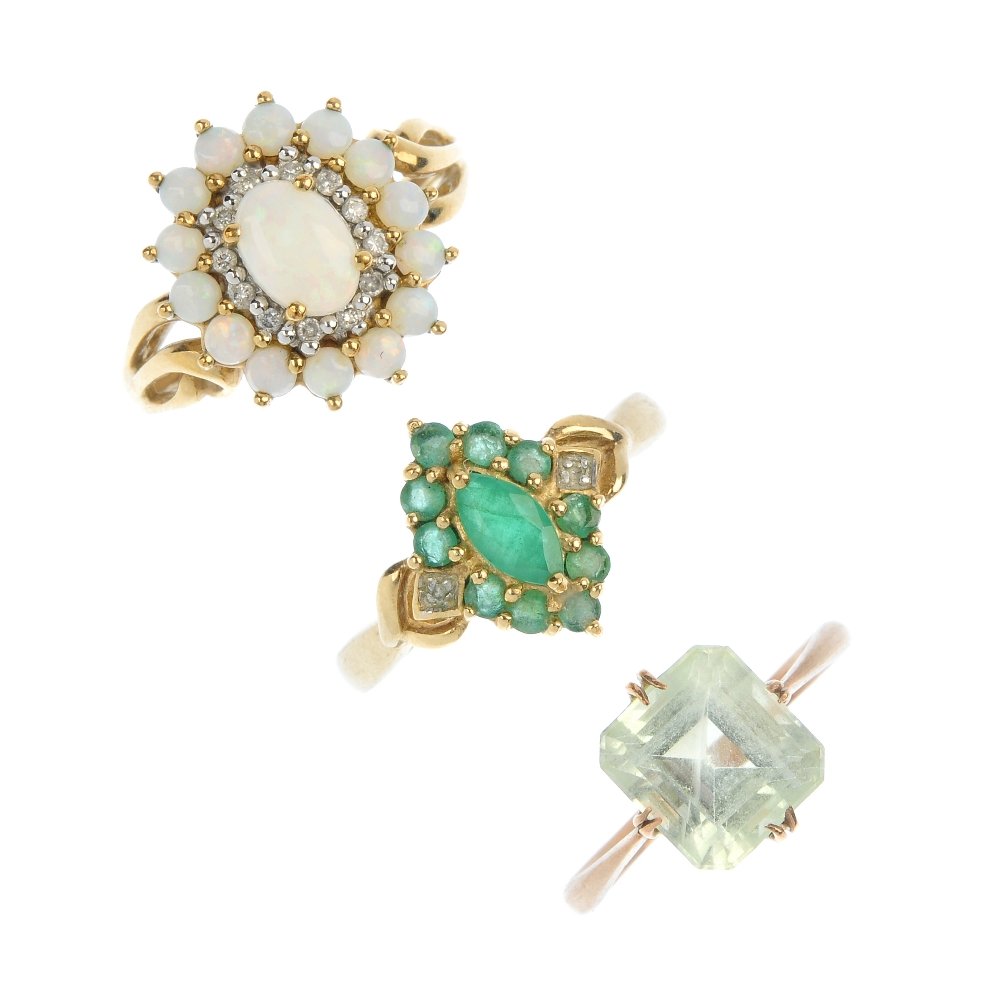 A selection of three 9ct gold gem-set rings.: A selection of three 9ct gold gem-set rings. To include an early 20th century green beryl single-stone ring, an emerald cluster ring, together with an opal and colourless paste cluster ring. Two with
