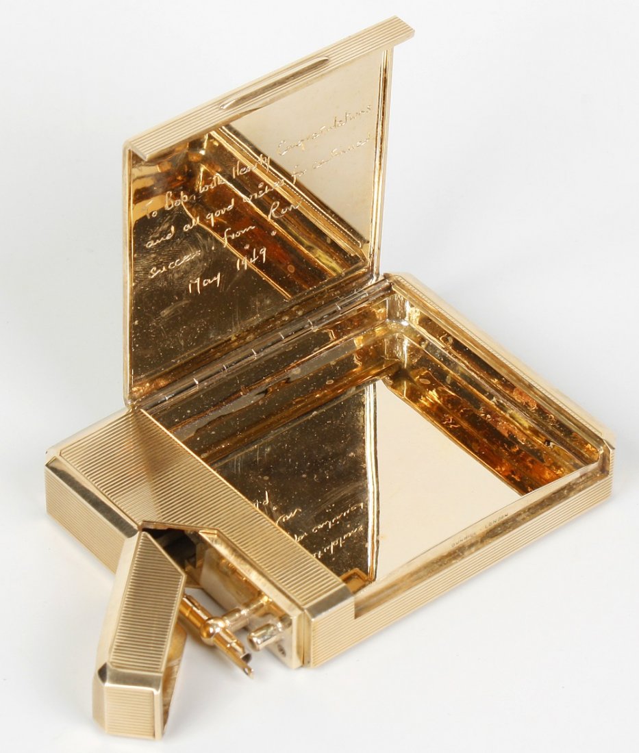 A fine Dunhill 9ct gold combination cigarette case and : A fine Dunhill 9ct gold combination cigarette case and lighter, the canted oblong case with concealed lighter to one short end, the ribbed body with ownership cartouche and lift-up cigarette compartme