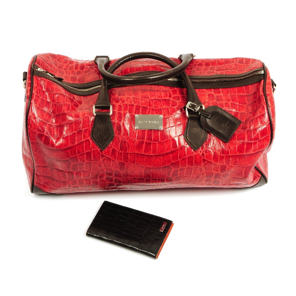 ETRO - a bag and wallet.: ETRO - a red crocodile leather holdall with brown leather trim, two top handles, metal hardware to include an engraved maker's name plate, detachable identification tag, zip closure and inner zip comp