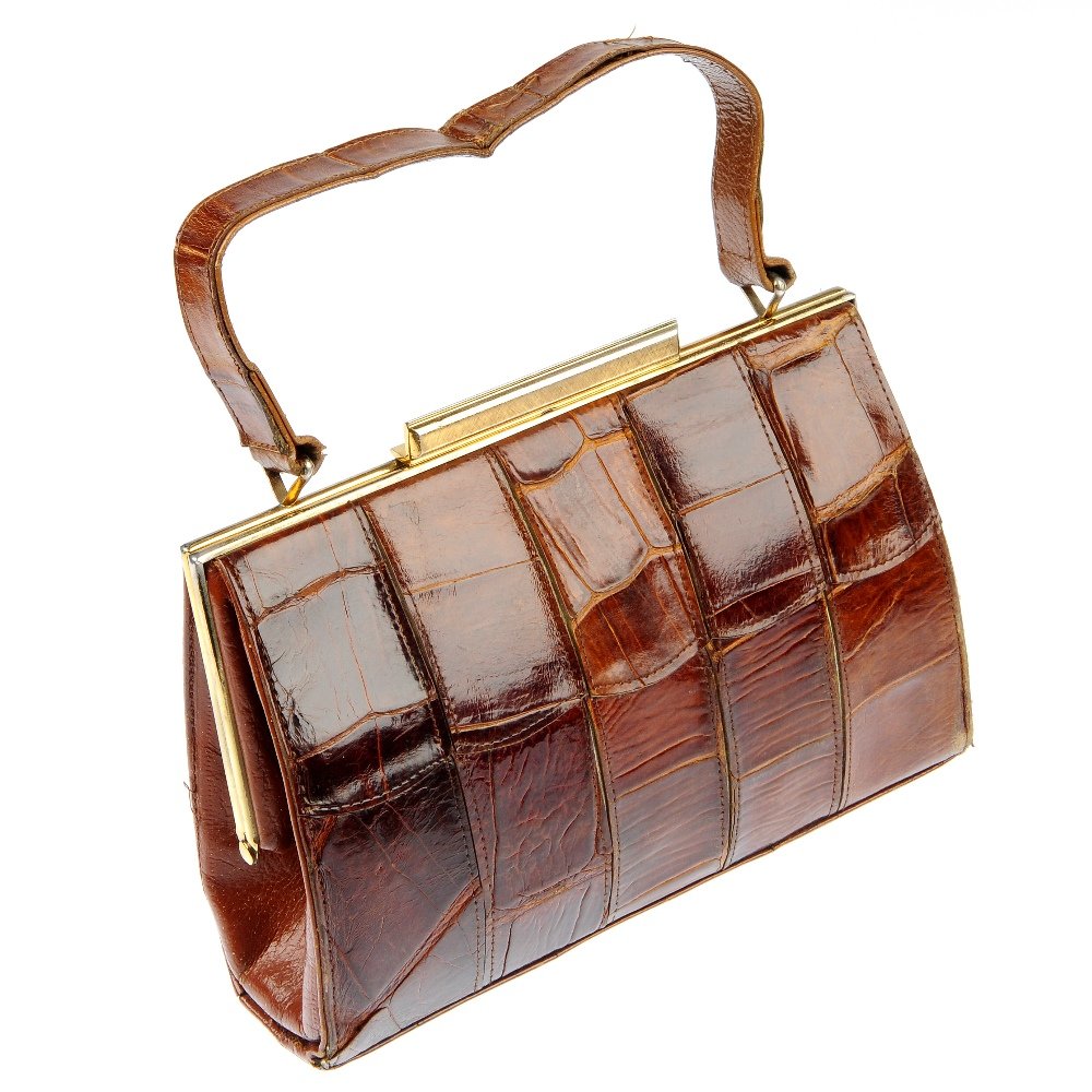 MAPPIN & WEBB - a mid 20th century leather bag and a: MAPPIN & WEBB - a mid 20th century, structured brown leather handbag, with panelled crocodile skin pattern, hinged gold-tone hardware and top latch closure, together with an early 20th century non des