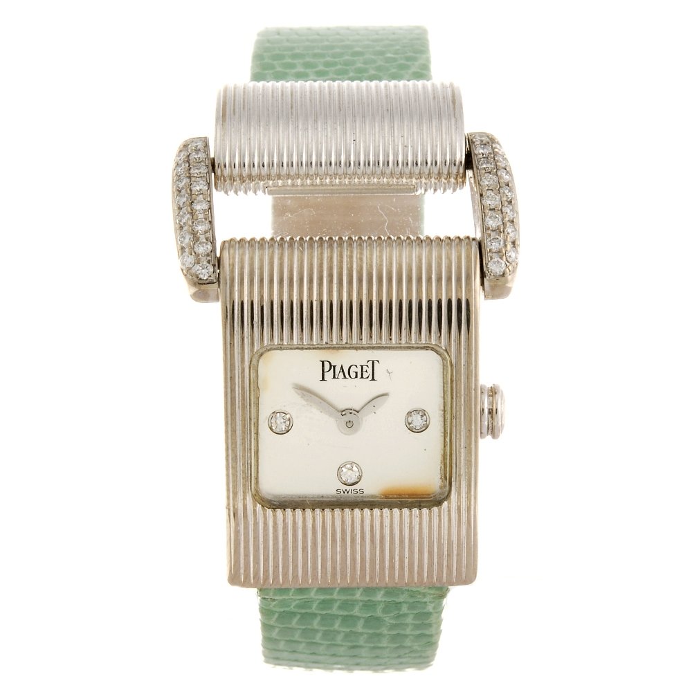 PIAGET - a lady's Miss Protocole wrist watch.: PIAGET - a lady's Miss Protocole wrist watch. Numbered 5222 853086. Signed quartz calibre 57P. Silvered dial with quarterly diamond markers. 18ct white gold case fitted to an authentic green lizard st