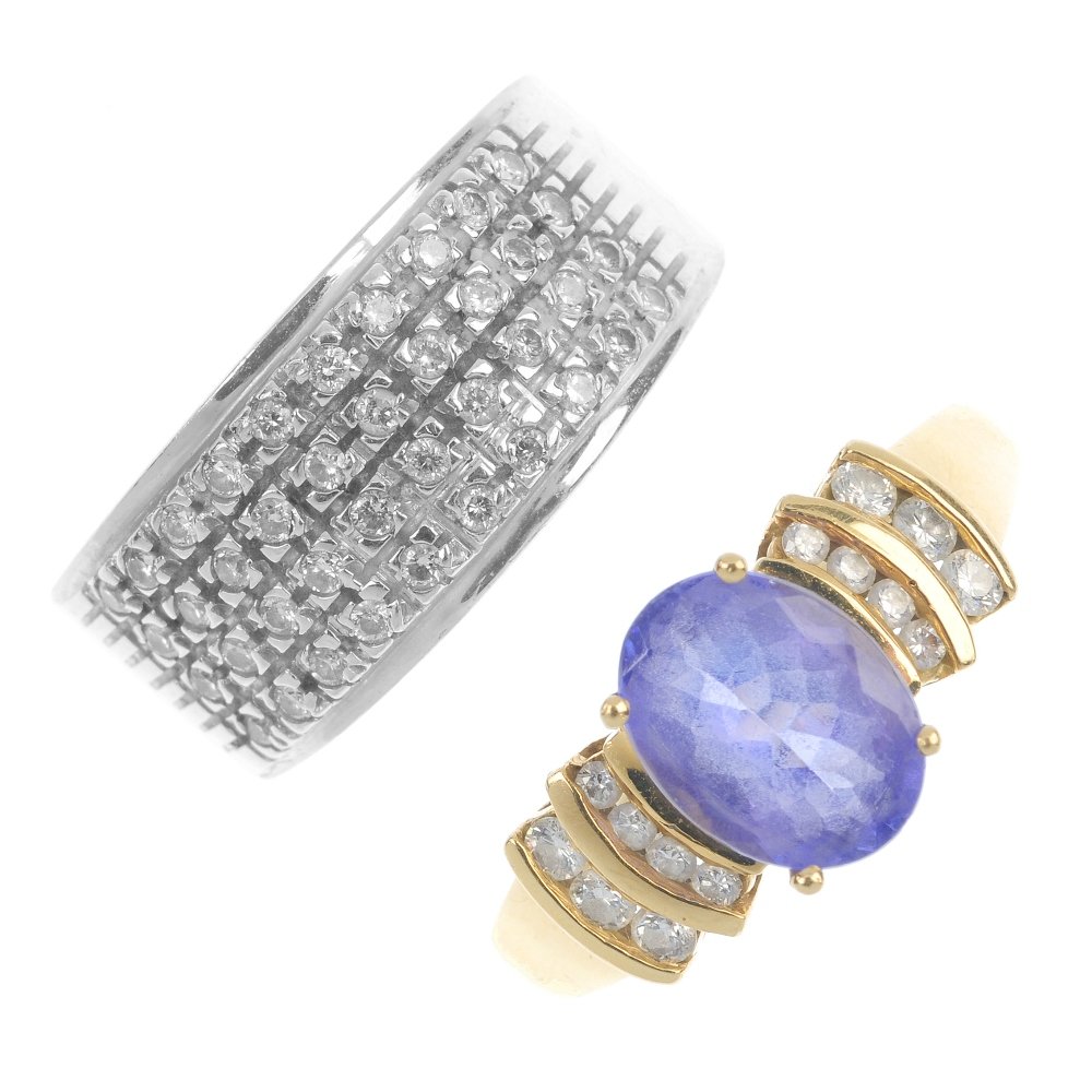 A tanzanite and diamond dress ring and a diamond band r: A tanzanite and diamond dress ring and a diamond band ring. The first designed as an oval-shape tanzanite to the brilliant-cut diamond curving sides, the second designed as a brilliant-cut diamond rec