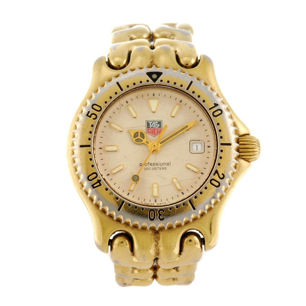 TAG HEUER - a lady's S/el bracelet watch.: TAG HEUER - a lady's S/el bracelet watch. Reference WG1330-2, number N74838. Signed quartz movement. Cream dial with luminous hour markers, date aperture to three. Calibrated bezel, gold plated case w