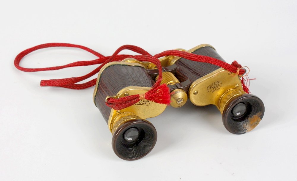 A pair of Carl Zeiss (Jena) 'Teleater' opera or field g: A pair of Carl Zeiss (Jena) 'Teleater' opera or field glasses, No. 1126008, 3 x 13.5 magnification, with snakeskin barrels in a crocodile skin case with mirror, the outer case 4.25" x 2" x 3" high, (1