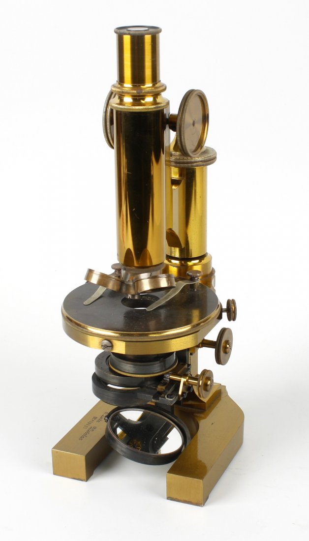 A late 19th century lacquered brass monocular microscop: A late 19th century lacquered brass monocular microscope, E. Leitz, Wetzlar, No. 19851, the main tube with a full set of interchangeable eyepieces and objectives, rack and pinion coarse focusing plus 