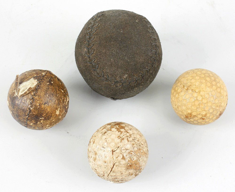 A box containing a mixed selection of assorted golf bal: A box containing a mixed selection of assorted golf balls, to include a stitched leather example 'spitfire' example in original wrapper, etc (10), together with a Walt Disney Mickey Mouse soft toy, et