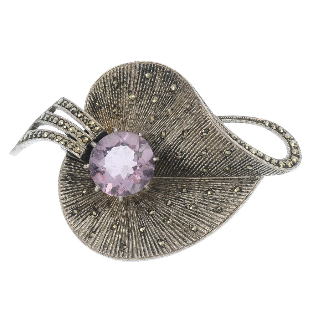 THEODOR FAHRNER - an early 20th century silver,: THEODOR FAHRNER - an early 20th century silver, amethyst and marcasite leaf brooch, the grooved leaf set throughout with marcasite to the central circular-shape amethyst. With maker's mark. Length 5.2