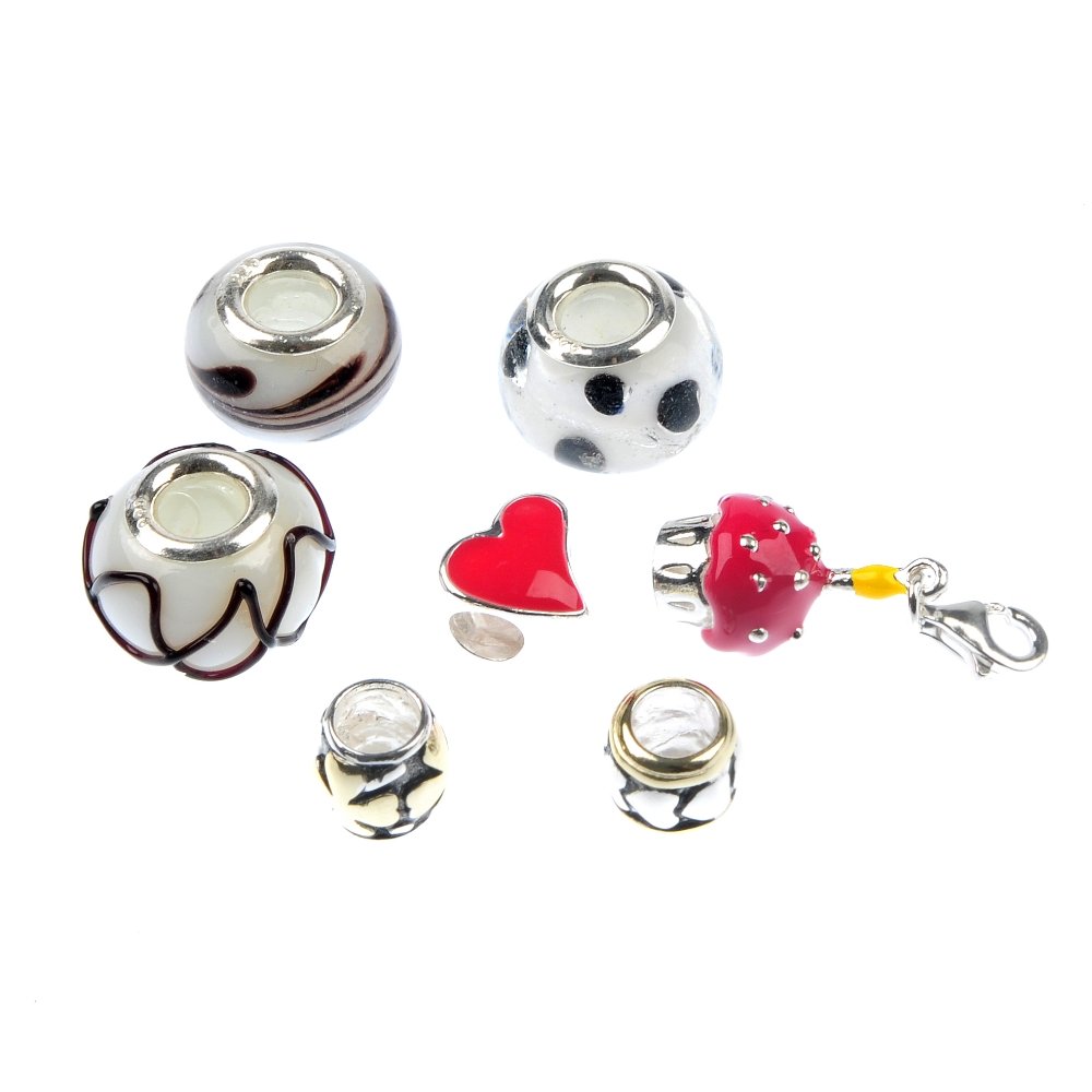 A selection of charms.: A selection of charms, to include a green paste charm, a red enamel ladybird charm and a pair of blue enamel charms. Approximately 200 charms. Most stamped 925. Gross weight 471gms.