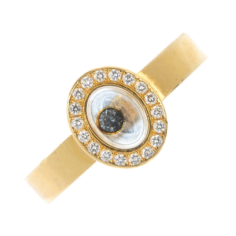 CHOPARD - an 18ct gold 'happy diamonds' ring.: CHOPARD - an 18ct gold 'happy diamonds' ring. The free-moving brilliant-cut diamond collet, to the similarly-cut diamond oval-shape surround and plain band. Signed Chopard. Estimated total diamond wei