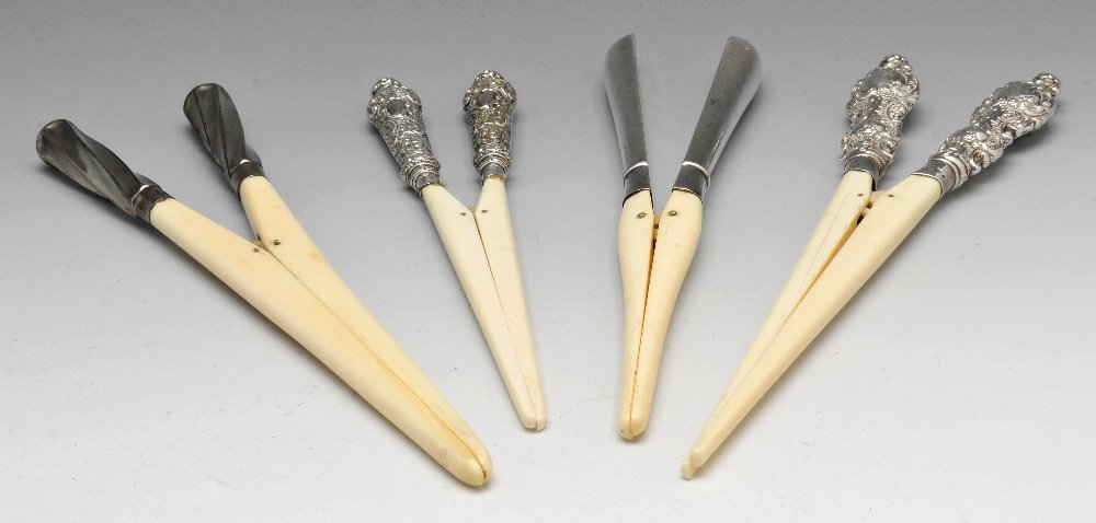 A selection of ten pairs of glove stretchers including: Three late Victorian pairs of silver handled and ivory glove stretchers, the first pair plain in design, hallmarked London 1893, the second with wrythen moulded handles, hallmarked London 1899, and th