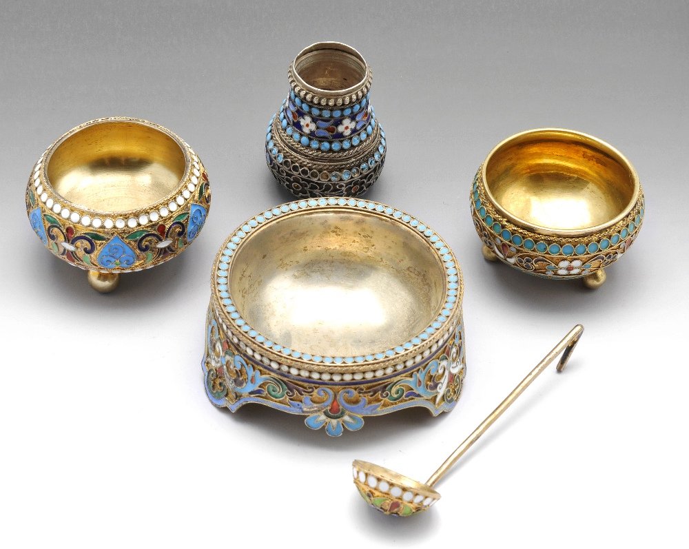 A selection of three Russian silver-gilt and cloisonne: A late nineteenth century Russian silver-gilt and cloisonné enamel open salt, Russian assay masters mark for Lev Fridrikhovitch Oleks,1892, Moscow, diameter measuring 1 1/2 inches (4 cm). Together wi