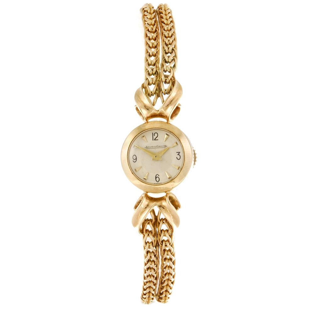 JAEGER-LECOULTRE - a lady's bracelet watch.: JAEGER-LECOULTRE - a lady's bracelet watch. Hallmarked London 1956. Numbered 2528. Signed manual wind movement. Silvered dial with gilt hour markers, quarterly black Arabic numeral hour markers. 9ct g