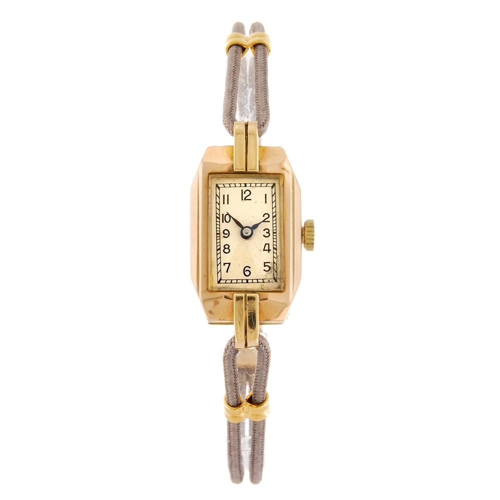 ROTARY - a lady's wrist watch.: ROTARY - a lady's wrist watch. Hallmarked London 1937. Signed manual wind movement. Silvered dial with Arabic numeral hour markers. 9ct gold case fitted to a grey cord strap with folding clasp. 13mm. 