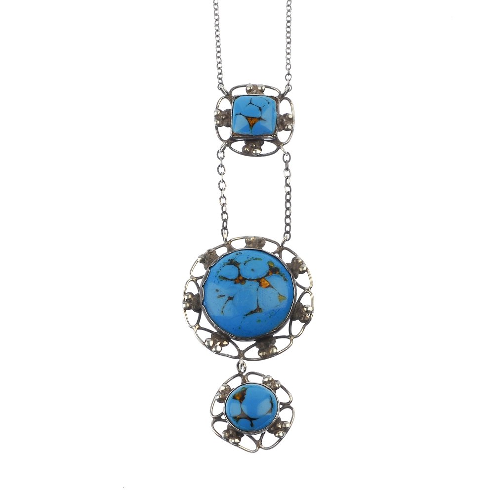BERNARD INSTONE (attributed to) - an enamel silver: BERNARD INSTONE (attributed to) - an enamel silver pendant, designed as two graduated circular blue enamel cabochon floral drops, suspended from a similarly-designed square surmount and belcher-link b