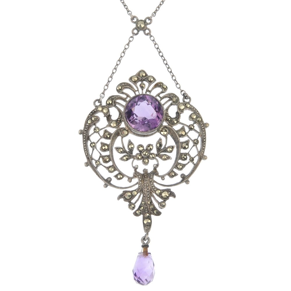 MEYLE & MAYER - an early 20th century amethyst and: MEYLE & MAYER - an early 20th century silver openwork amethyst and marcasite lavalier pendant, the circular-shape amethyst within a marcasite scrolling foliate surround, to the suspended amethyst drop