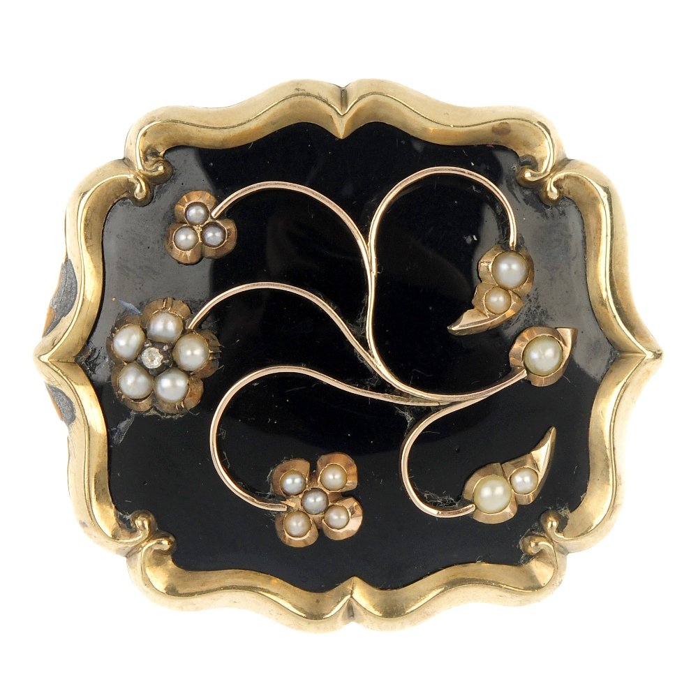 A late Victorian split pearl and enamel panel brooch,: A late Victorian split pearl and enamel panel brooch, the split pearl and paste floral motif, to the black enamel panel with scrolling border. Length 4.1cms. Weight 14.9gms.