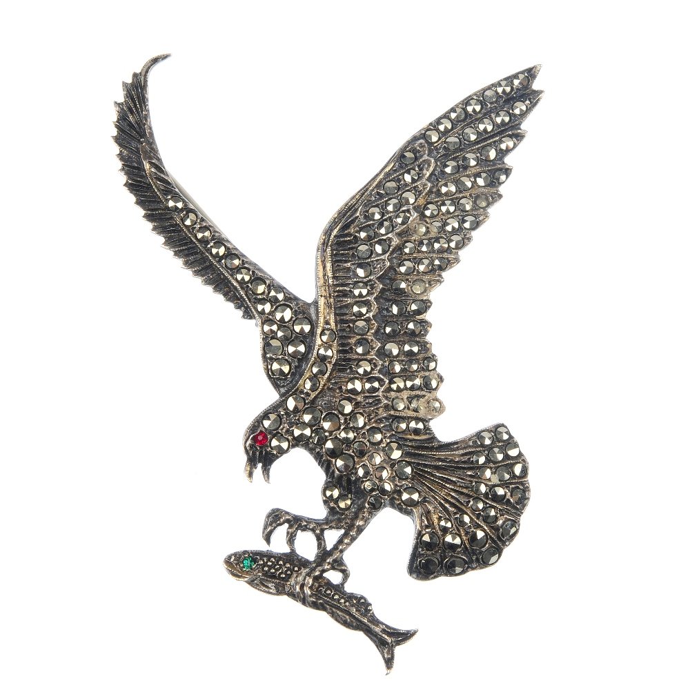 Three marcasite bird brooches: Three marcasite bird brooches, to include a swallow brooch, a seagullbrooch with red paste eye and an eagle brooch, with outstretched wings, clutching a fish within its talons. One stamped silver. Len