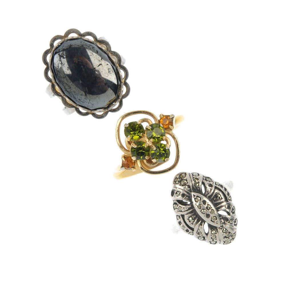 A selection of eleven assorted rings.: A selection of eleven assorted rings, to include a multi-gem and paste cluster ring set with a series of pear-shape gem cabochons, to include ruby, emerald and moonstone, together with a shell cameo r