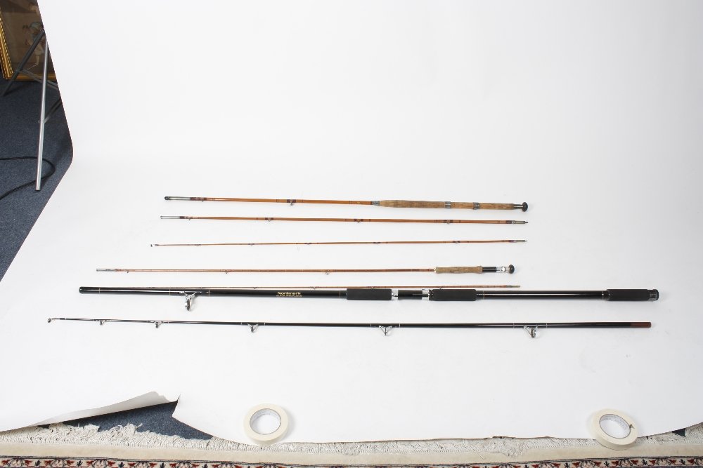 Fishing Interest: Three assorted rods: Fishing Interest: Three assorted rods, comprising an Allcock 'Shannon' three piece split cane rod, 13'3" (404cm) in cloth bag, a Rudge of Redditch two-piece rod, and a Normack carbon fibre sea rod. (3