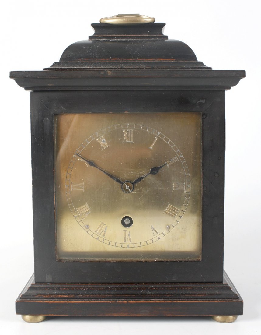An 19th century-style ebonised mantel clock, Astral of : An 19th century-style ebonised mantel clock, Astral of Coventry, with 5-inch square brass Roman dial, single train timepiece movement with lever platform escapement, the backplate with winder motif, s