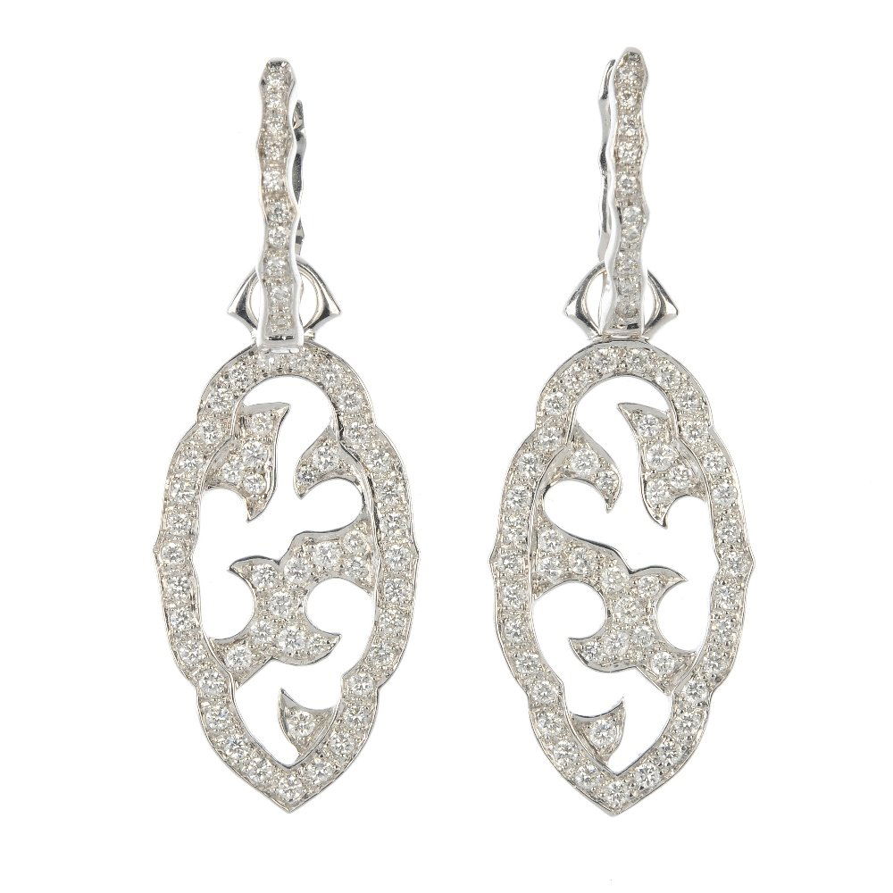 STEPHEN WEBSTER - a pair of 18ct gold diamond 'Borneo': STEPHEN WEBSTER - a pair of 18ct gold diamond 'Borneo' ear pendants. Each designed as a pave-set diamond scalloped panel, with similarly-set diamond openwork foliate motif, to the diamond line surmoun