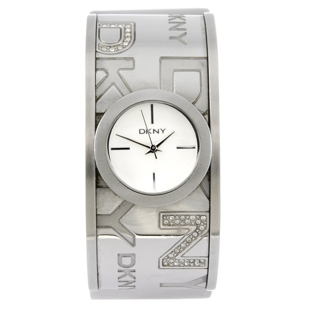 (962003177) DKNY - a lady's bangle watch.: (962003177) DKNY - a lady's bangle watch. Quartz movement. Silvered dial. Stainless steel case fitted to a stainless steel bangle with clasp. 27mm.