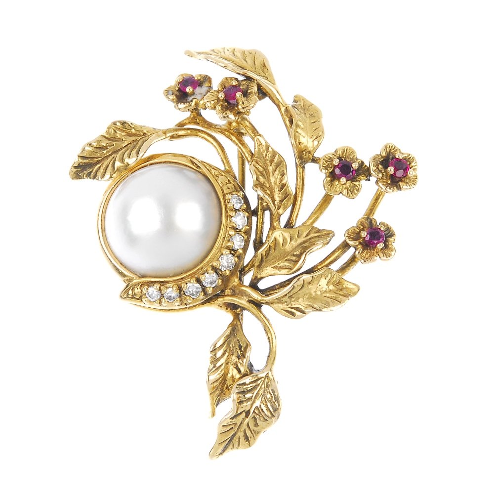 GIVENCHY - a 1980s 14ct gold diamond and gem-set floral: GIVENCHY - a 1980s 14ct gold diamond and gem-set floral brooch. The mabe pearl, with brilliant-cut diamond curved line accent, to the circular-shape ruby foliate spray. Signed Givenchy '86. Estimated 