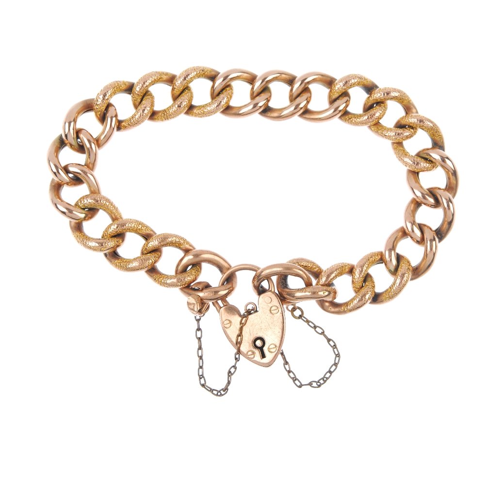 Two bracelets and a ring.: Two bracelets and a ring. To include two early 20th century 9ct gold alternately engraved and polished curb-link bracelets, each with heart-shape padlock clasp, together with a mid 20th century 9ct go