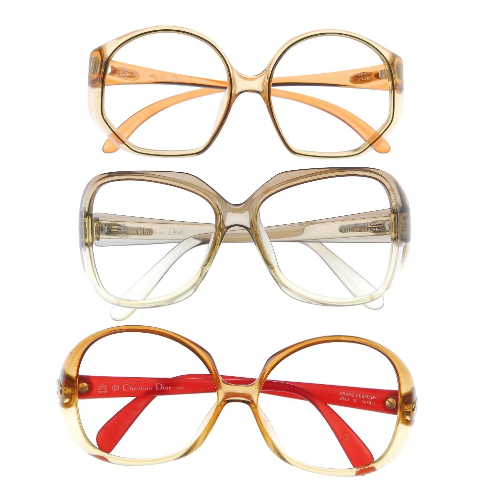CHRISTIAN DIOR - five pairs of glasses frames.: CHRISTIAN DIOR - five pairs of plastic glasses, without lenses, all with similar graduated coloured frames, with maker's logos on the temples. Three with maker's pouches.