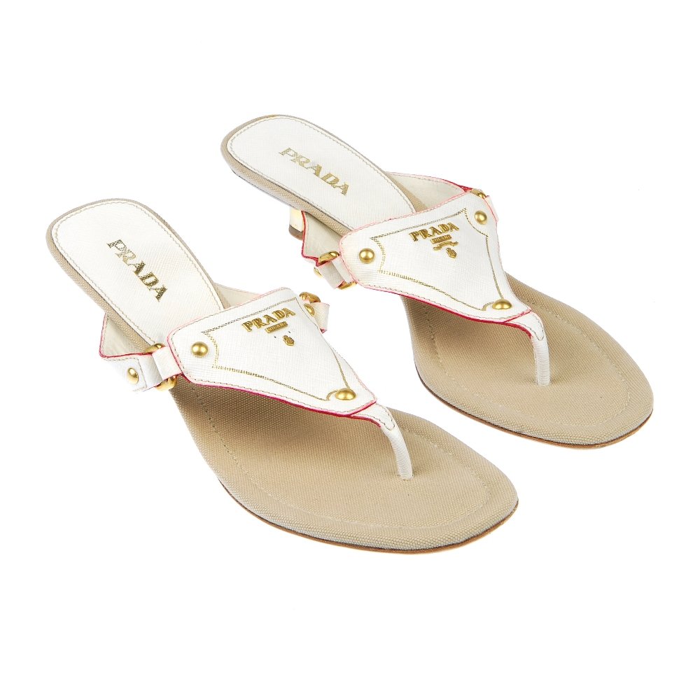 PRADA - kitten heel sandals: PRADA - a pair of white kitten heeled sandals