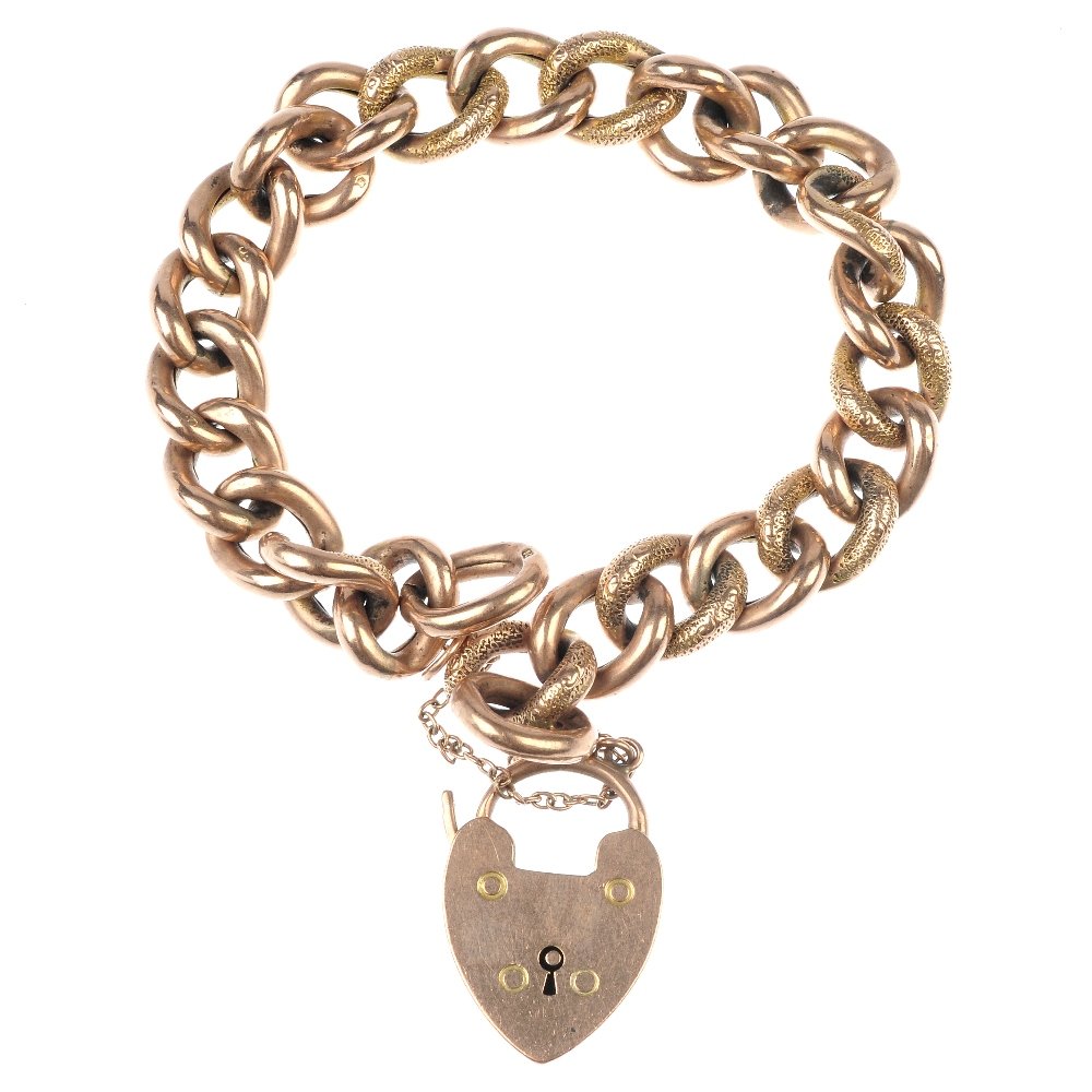 An early 20th century 9ct gold bracelet.: An early 20th century 9ct gold bracelet. The curb-link chain, with alternating polished and textured links, to the heart-shaped padlock clasp. Length 19.5cms. Weight 18gms.