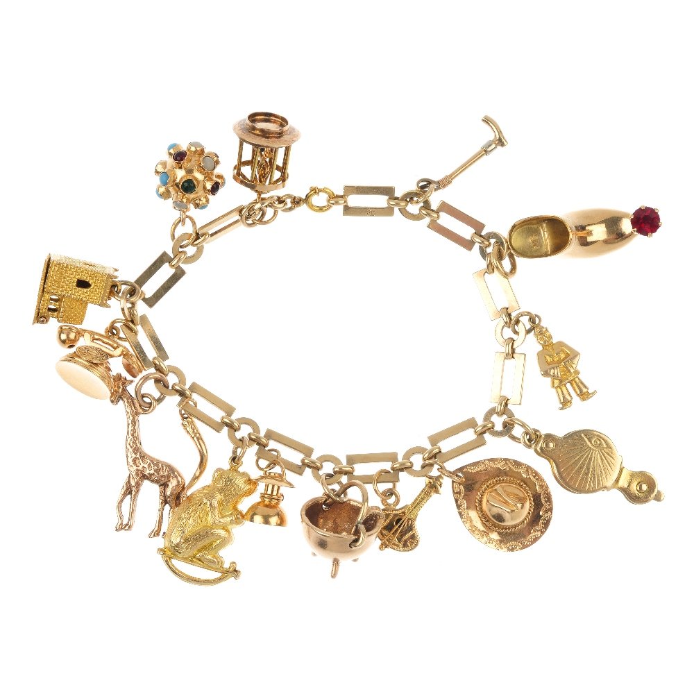 A charm bracelet.: A charm bracelet. The fancy-link bracelet, suspending fifteen charms, to include a caldron, an enamel bird cage, a bi-colour riding crop and a monkey. Two charms with hallmarks for 9ct gold. Length 18