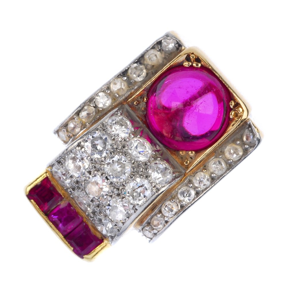 A mid 20th century gold synthetic ruby and diamond: A mid 20th century gold synthetic ruby and diamond ring. Of geometric design, the circular-cut diamond scrolling panels, with circular synthetic ruby cabochon and square-shape synthetic ruby line deta