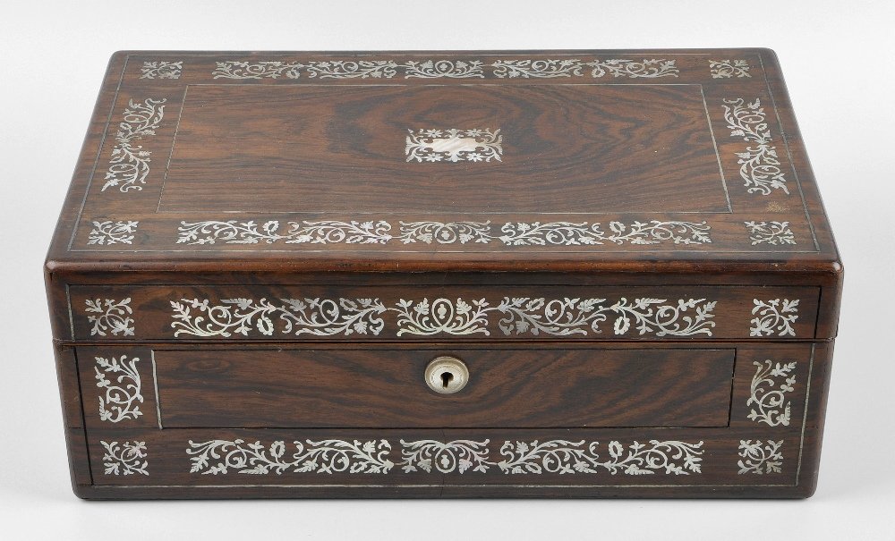A late 19th century rosewood veneered writing box: A late 19th century rosewood veneered writing box, the foldover top lifting to reveal a green tooled leather writing surface with pen tray and inkwell aperture, the front and top with shell inlay and 