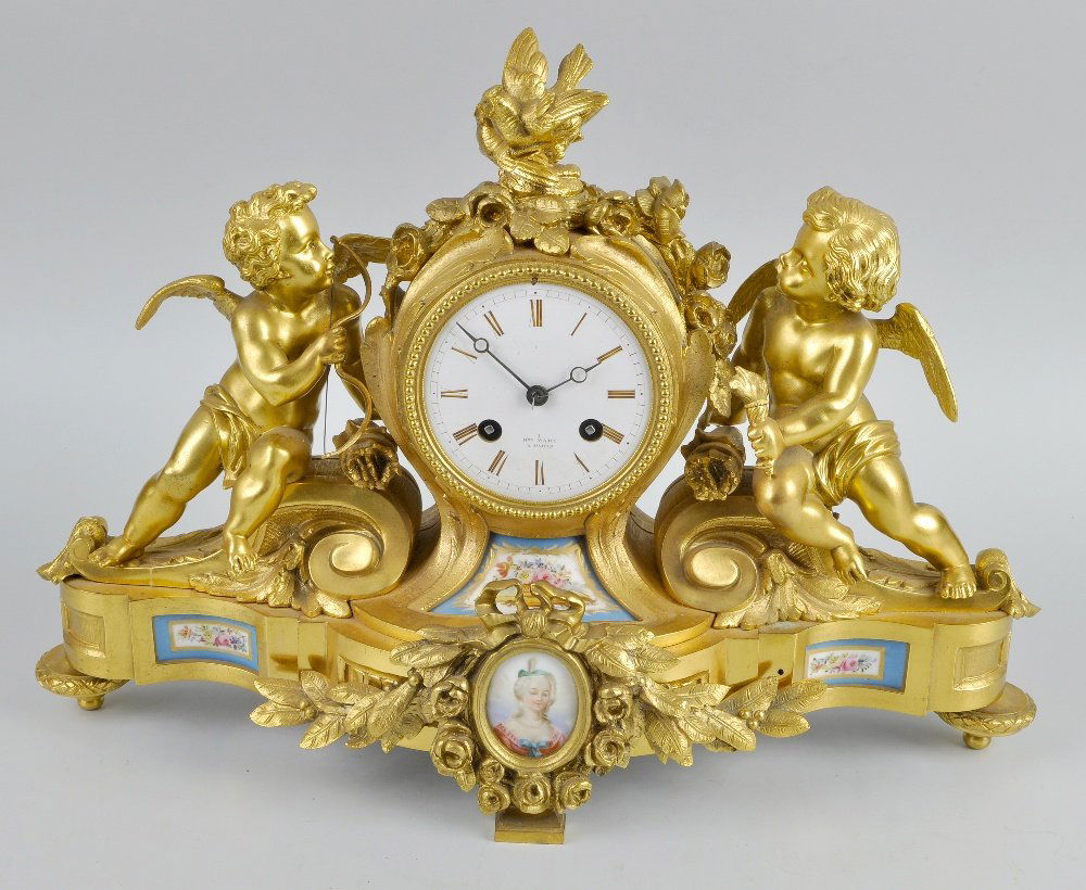 A good mid 19th century French ormolu and porcelain: A good mid 19th century French ormolu and porcelain mantel clock Japy Freres & Cie, Paris, retailed by Henry/Henri Marc, Paris The 3.25-inch white-enamelled Roman dial inscribed "1 HRY MARC A PARIS",