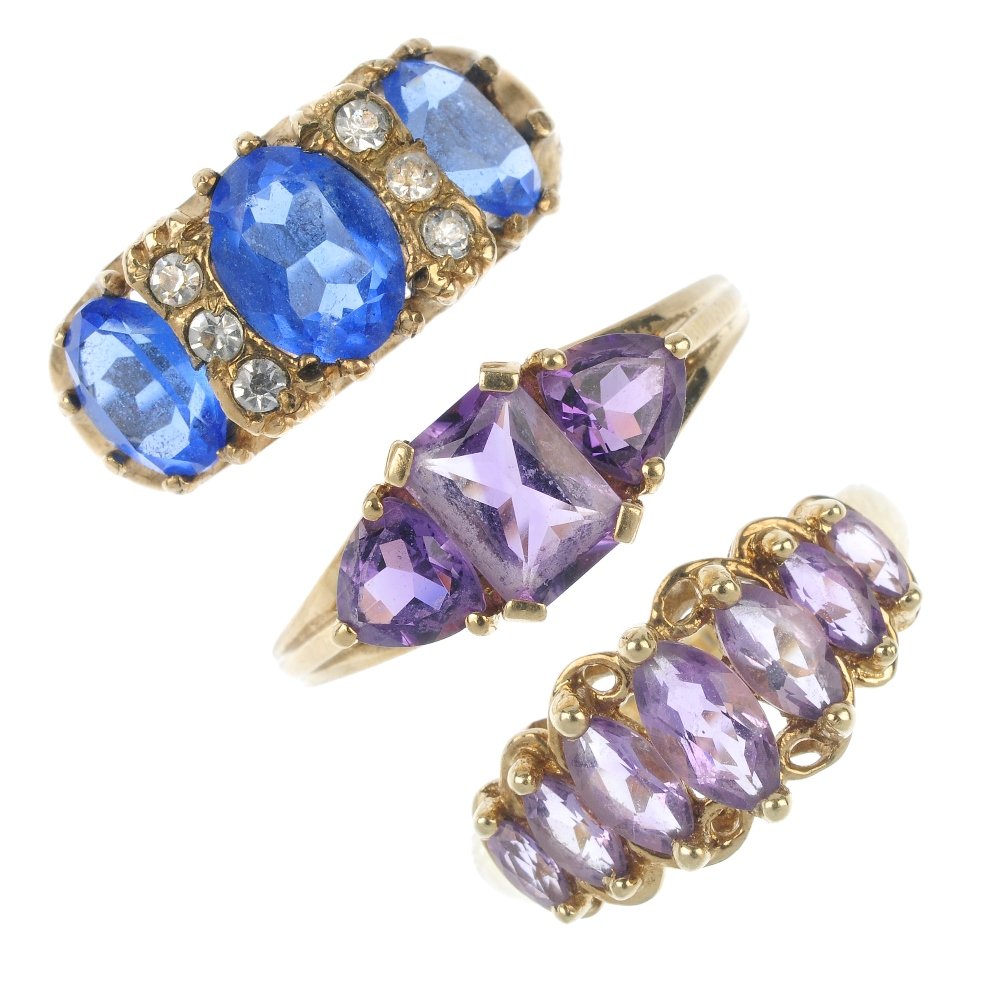 A selection of five 9ct gold gem-set and paste rings.: A selection of five 9ct gold gem-set and paste rings. To include a vari-shape amethyst three-stone ring, a marquise-shape amethyst seven-stone ring, together with three further gem-set rings. Hallmark