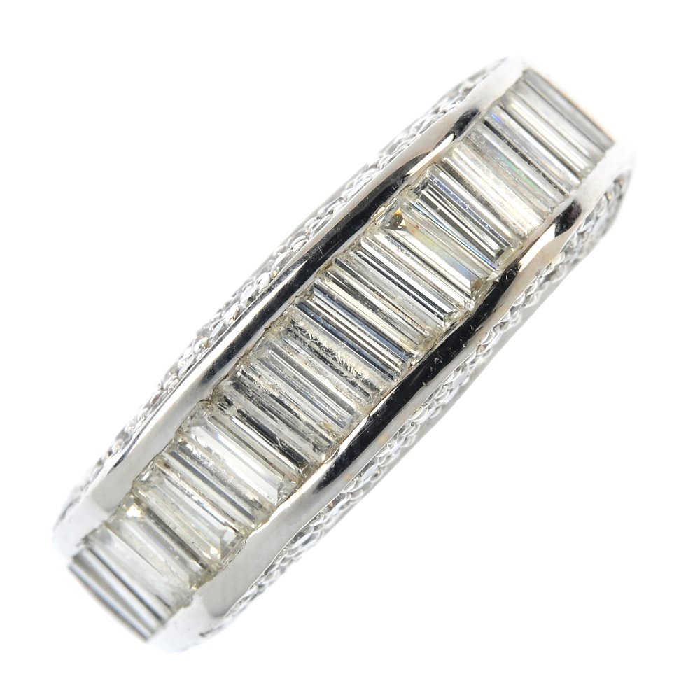 A diamond dress ring.: A diamond dress ring. Designed as a rectangular-shape diamond line, to the pave-set diamond sides and square-shape tapered band. Estimated total diamond weight 1.25cts. Weight 5gms.