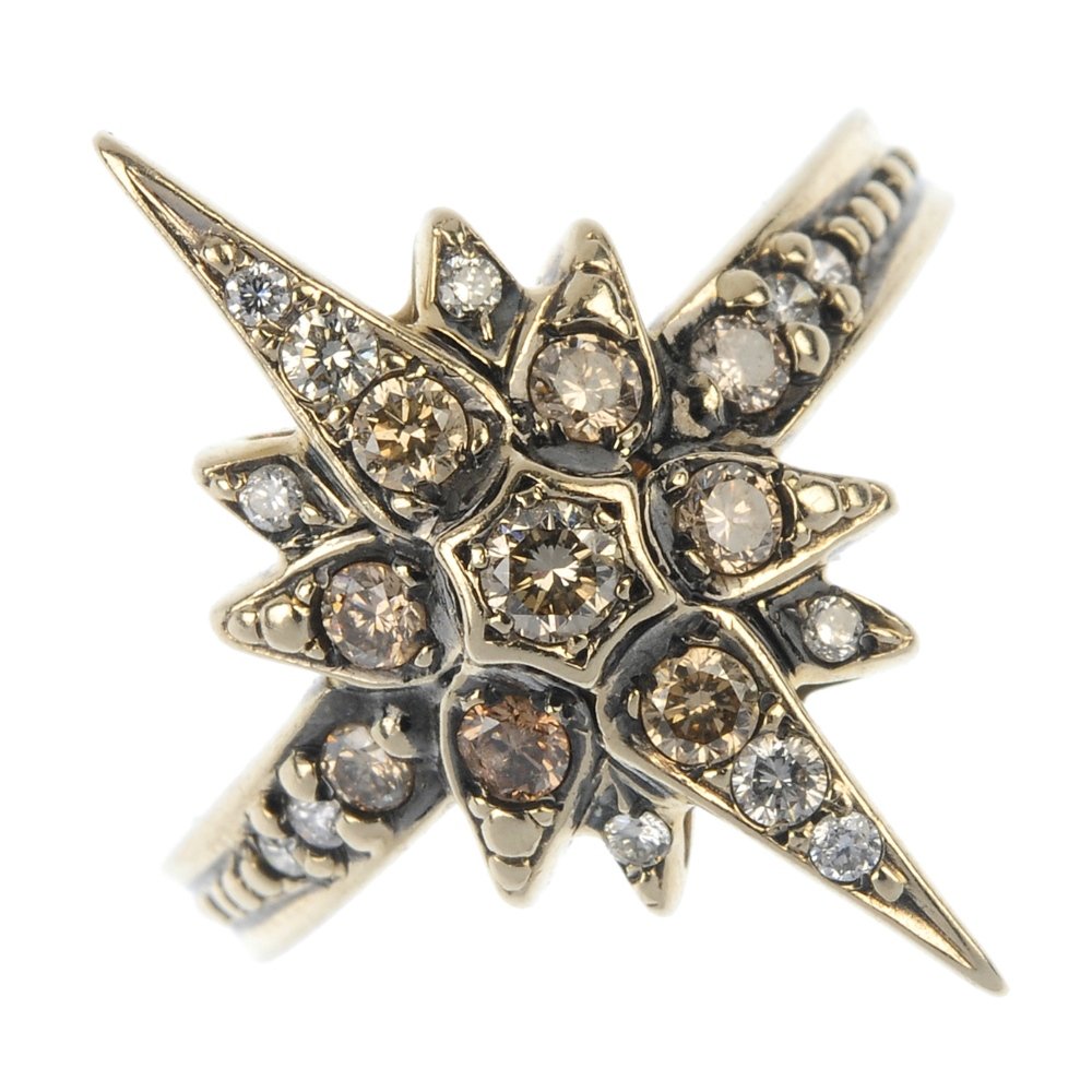 H STERN - a diamond dress ring.: H STERN - a diamond dress ring. The brilliant-cut diamond star, to the similarly-cut diamond shoulder and grooved band. Maker's marks for H Stern. Estimated total diamond weight 0.35ct. Weight 2.7gms.