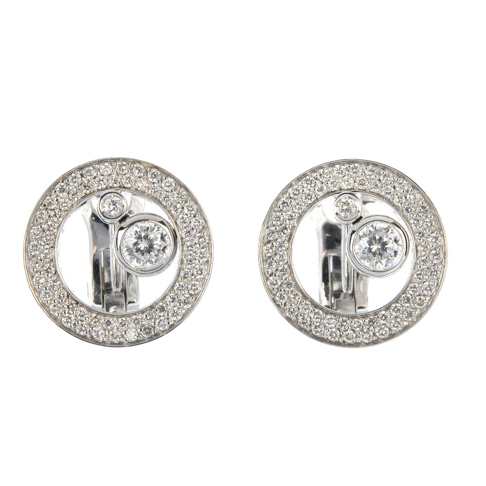 ROBERTO COIN - a pair of diamond ear studs.: ROBERTO COIN - a pair of diamond ear studs. Each designed as two brilliant-cut diamond articulated collets, suspended within a brilliant-cut diamond double-row circle. Signed Roberto Coin. Estimated t