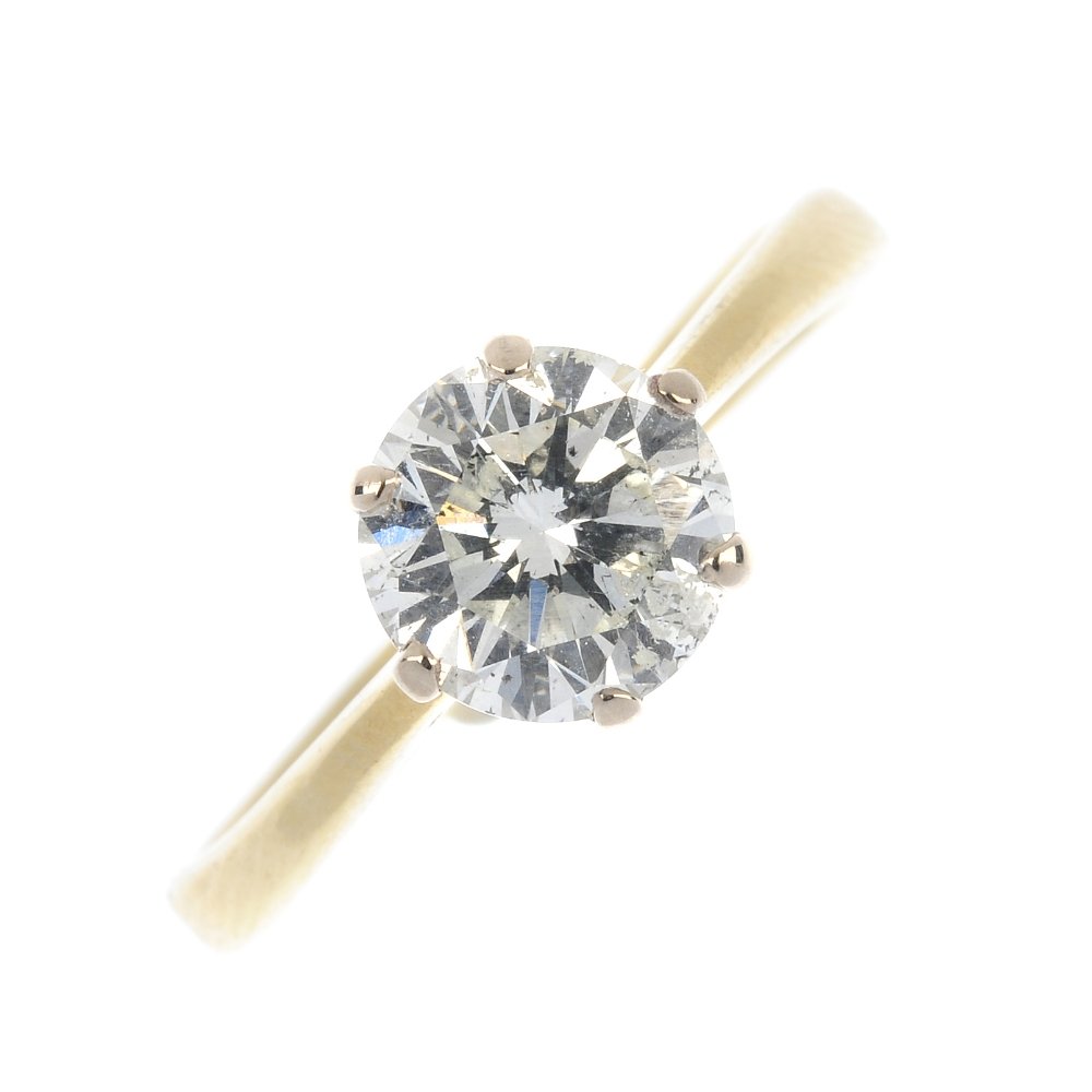 An 18ct gold diamond single-stone ring.: An 18ct gold diamond single-stone ring. The brilliant-cut diamond, to the plain band. Estimated diamond weight 1.55cts, J-K colour, P2 clarity. Hallmarks for London, 1995. Weight 3.9gms.
